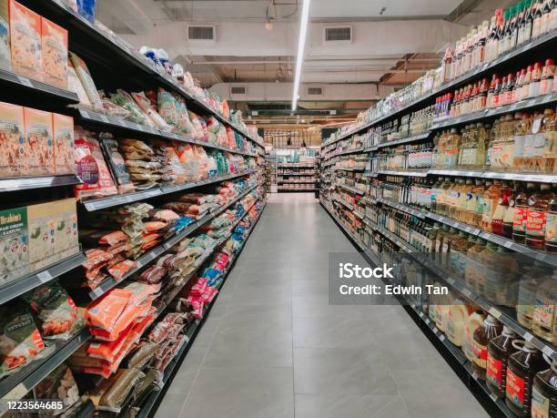 Interior Of Supermarket Full Of Grocery Items In Rows With Shelf Displayed Stock Photo - Download Image Now