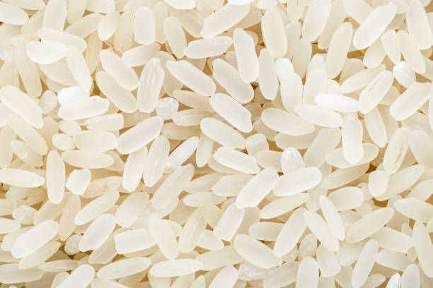 istock Rice grains close-up, top view. Background concept for design. 1223565688