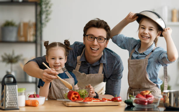istock Happy family in the kitchen. 1223568134