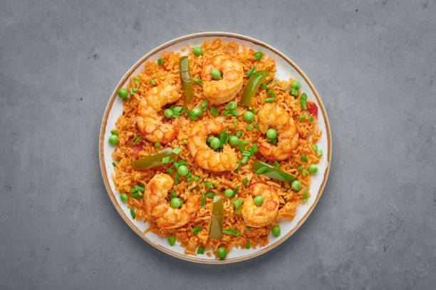 istock Thai Tom Yum Fried Rice or Prawn Biryani in white plate on grey concrete backdrop. Thailand cuisine dish. Thai Food 1223571591