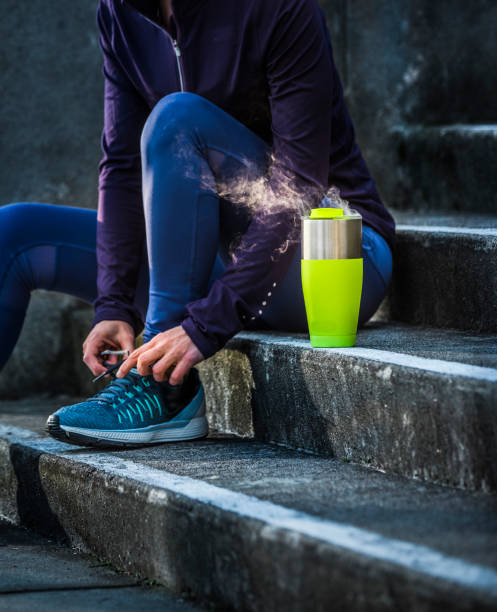 Woman stretching and getting ready to go for a run Woman stretching and getting ready to go for a run petaluma stock pictures, royalty-free photos & images