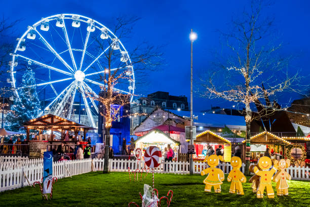 Christmas in Galway, Ireland Christmas decorations and market with ferris wheel in downtown Galway, a city in the West of Ireland. People in background. county galway stock pictures, royalty-free photos & images