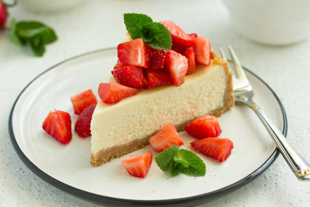 istock Slice of cheesecake with strawberries, mint and sauce. Selective focus 1223577813
