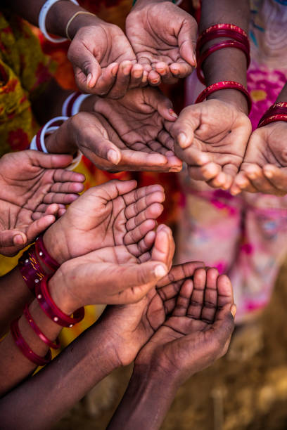 istock Hands of poor - African children asking for drinking water 1223581935