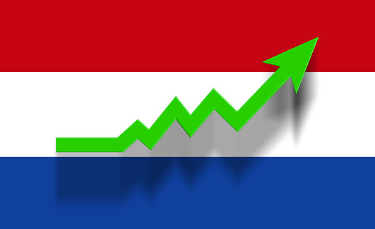 Green success graphic arrow moving up on Dutch flag. Horizontal composition with copy space. Economy and finance concept