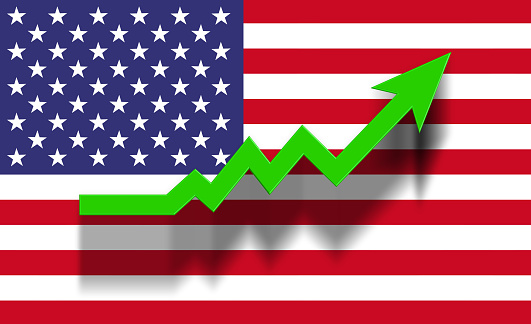 Green success graphic arrow moving up on USA flag. Horizontal composition with copy space. Economy and finance concept