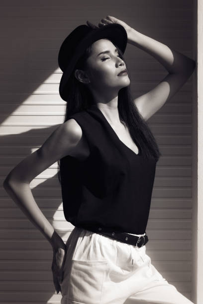 Girl walks around the city in the morning. Black and White