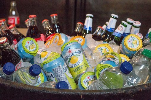 Cold Beverages in Borough Market, London, including Coke and San Pellegrino, cooling in an ice bucket