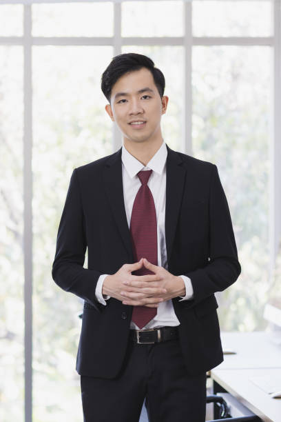 istock Asian Businessman standing and posing in office. 1223586299