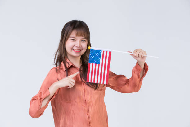 istock Man pointing to American flag. 1223587120