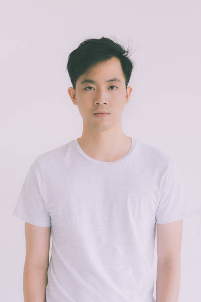 istock Young Asian man model in T-shirt standing. 1223587231