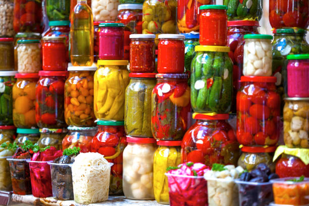 istock Preserved vegetables in glass jars 1223587318