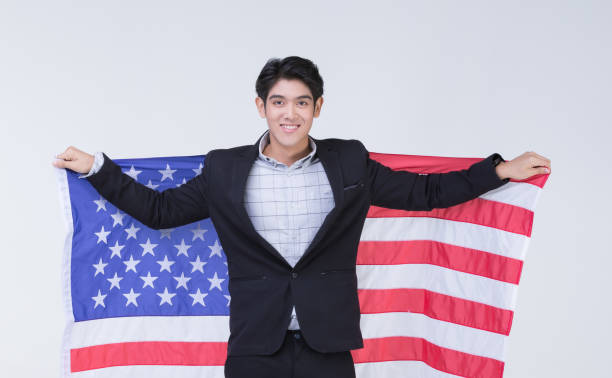 istock Asain man holding American flag. 1223587460