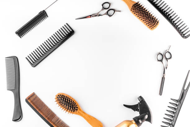 istock Hairdressing equipment. Combs, scissors on white desk top-down frame space for text 1223587473