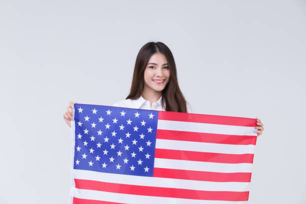 istock Asain woman holding American flag. 1223587771