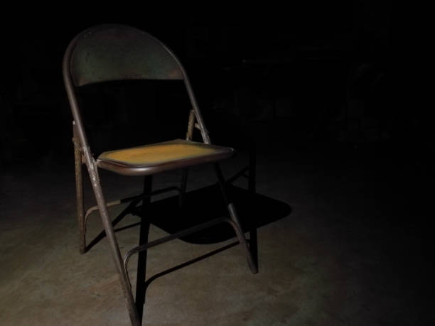 istock Rusty old chair in the darkest 1223590005