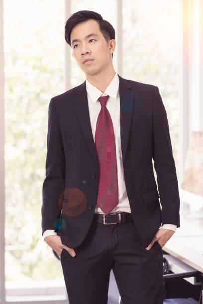 istock Asian Businessman standing and posing in office. 1223591315