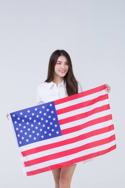 istock Asain woman holding American flag. 1223592462