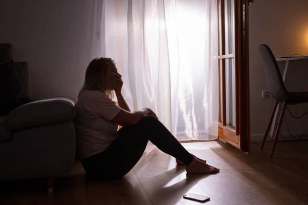 istock Sad depressed woman crying at home during COVID-19 1223592567