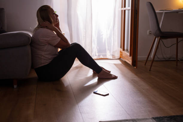 istock Sad depressed woman crying at home 1223592585