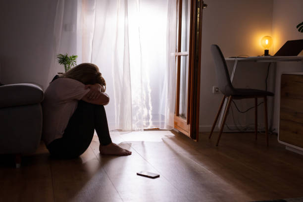 istock Sad depressed woman crying during home isolation 1223592601