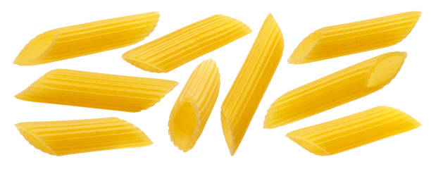 Raw italian penne rigate pasta isolated on white background Raw italian penne rigate pasta isolated on white background with clipping path penne stock pictures, royalty-free photos & images