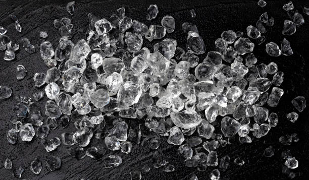 istock Pile of crushed ice on black stone background 1223592752