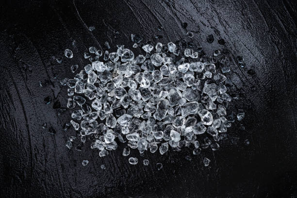 istock Pile of crushed ice on black stone background 1223592770