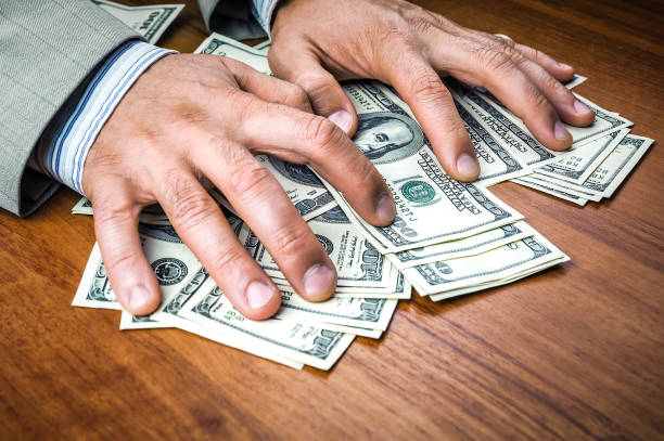 istock the corruptor in the suit takes a bribe 1223593752