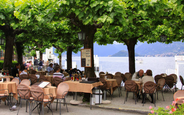 People at restaurant in Bellagio, Lake Como, Italy stock photo