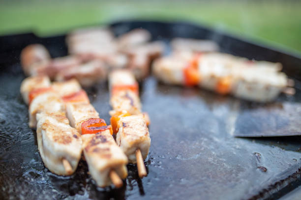 Close-up shot of shasliks cooking on a barbecue grill
