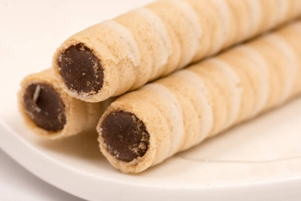 istock Closeup macro wafer chocolate cream rolls 1223595105