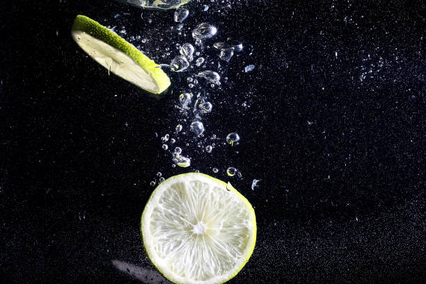 istock Water drops on ripe sweet lemon. Fresh lime  background with copy space for your text. Vegan concept. 1223595612