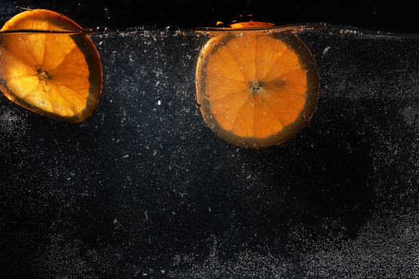 istock Water drops on ripe sweet orange. Fresh mandarin background with copy space for your text. Vegetarian concept. 1223596030