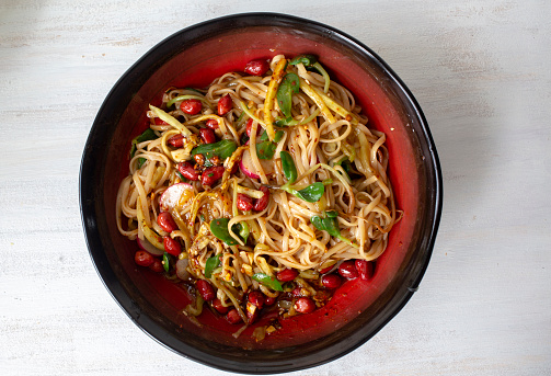 Chinese homemade noodles: spicy stirred noodles with radish and bean spout
