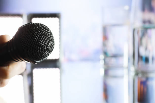 istock The microphone on the stage in front of the hall. Performance on stage. 1223598819