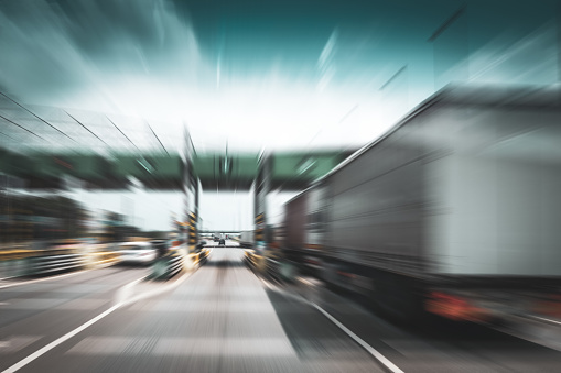 Highway toll gate, truck - motion blur.