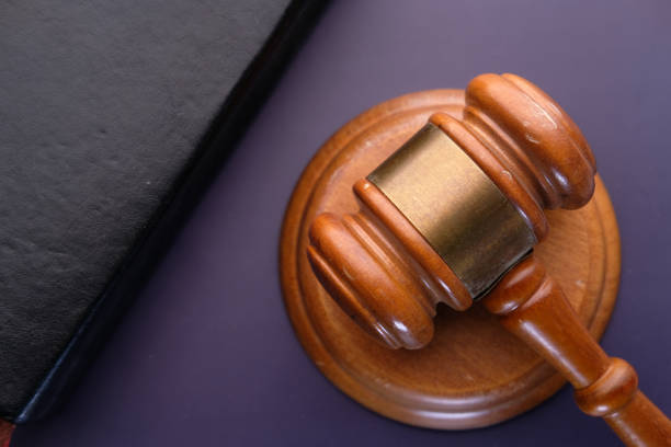 istock Close up of gavel, book on black background 1223602658