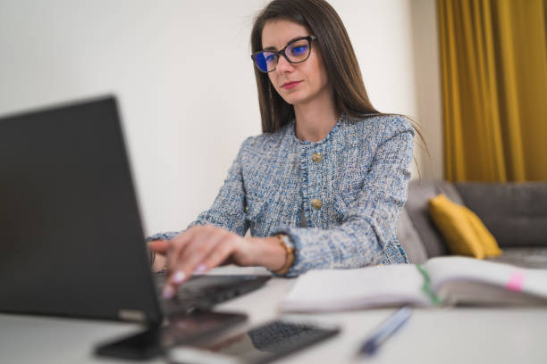 istock woman with glass home office working during covid 19 quarantine 1223602886