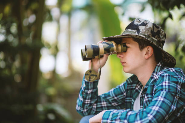 istock Adventure teenager  looking through binoculars 1223602945