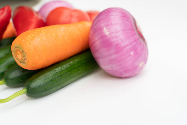 A close-up of vegetable ingredients on a white background
