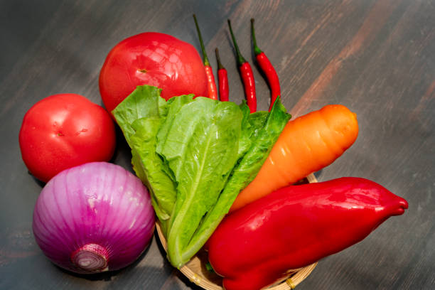 A group of vegetable ingredients in dark background