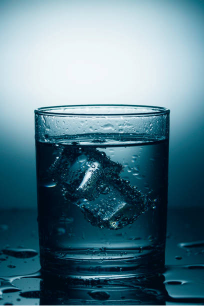 istock Glass of mineral water with ice. Dramatic light 1223604285