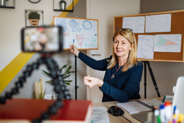 cheerful professor communicate with pupils over video call - online university imagens e fotografias de stock