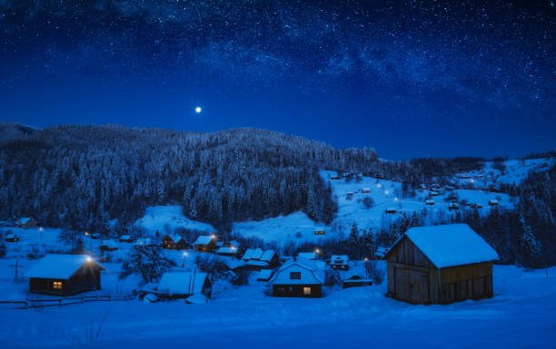 istock Moonrise in a starry sky over the mountain village 1223605572