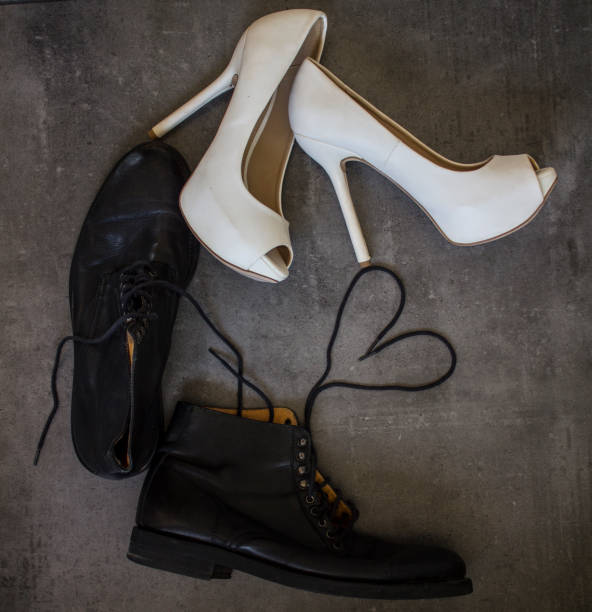 istock Just married. Bride and groom shoes 1223607351