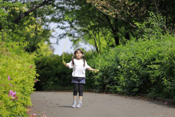 istock Japanese girl (5 years old) playing with jump rope 1223608210
