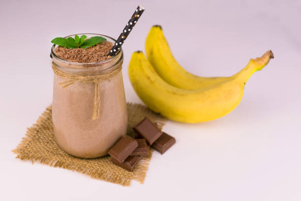 istock Chocolate milk and banana smoothie on a white background. 1223608575