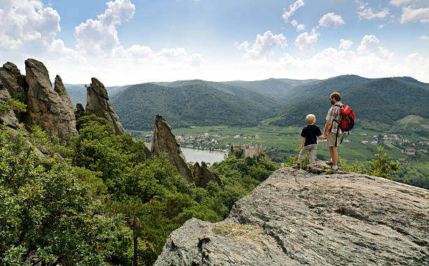 Father and son walking in the Wachau in Lower Austria near the ruins of Dürnstein