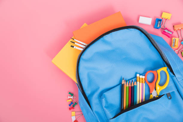 istock Blue bag backpack for education children on pink background back to school concept 1223611128